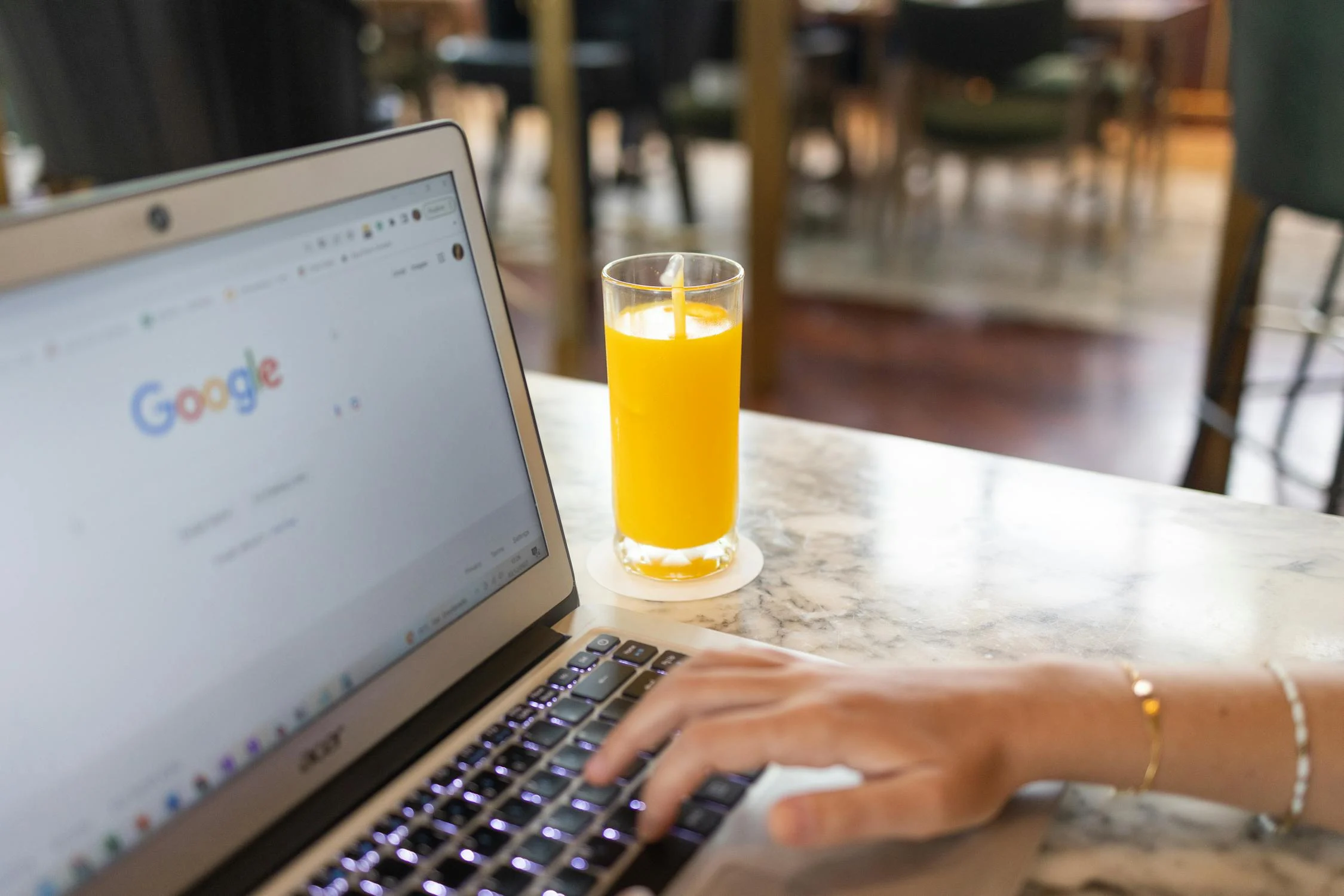 person working on laptop - SEO tips for ranking above big brands