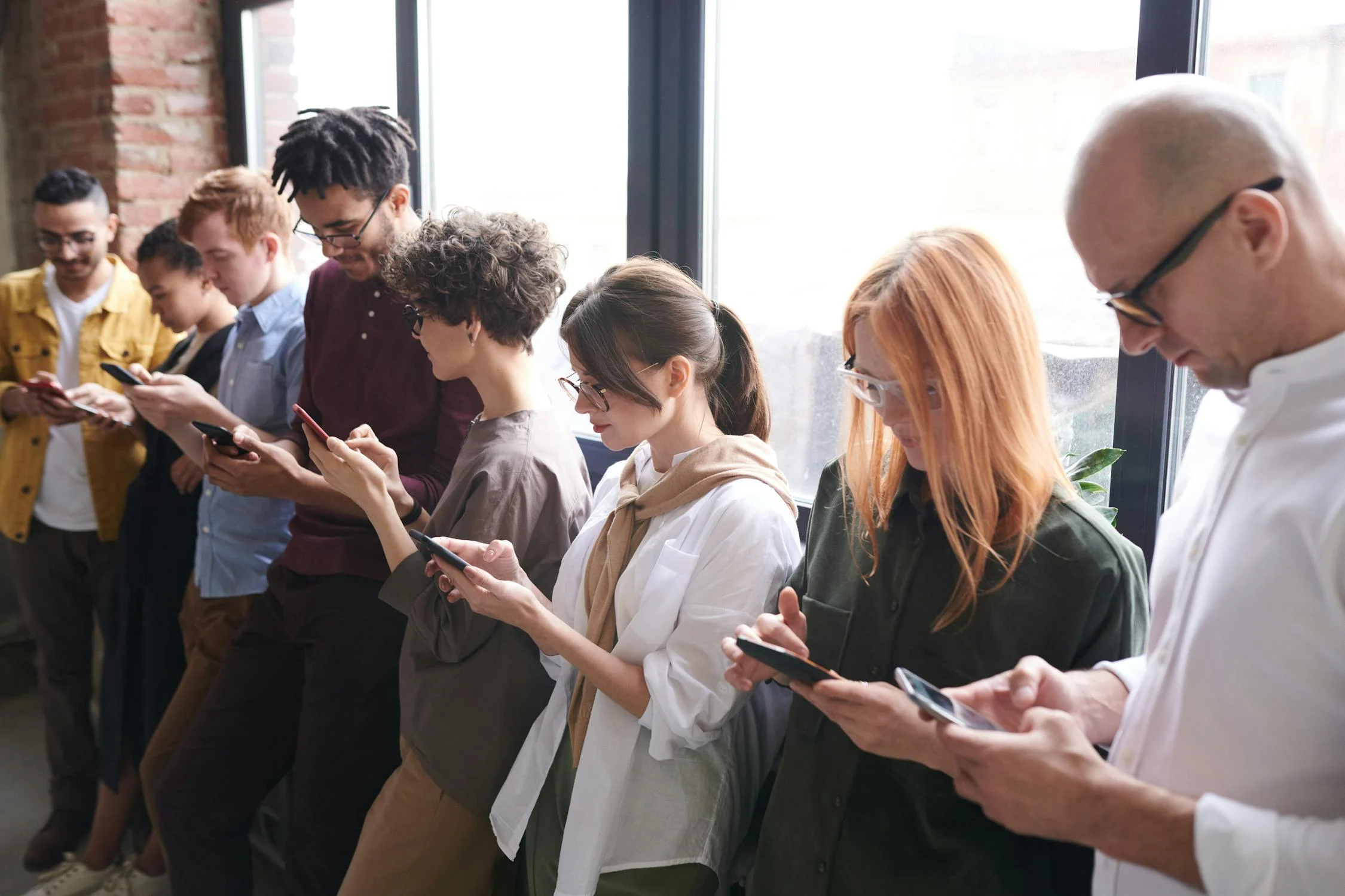 people using mobile devices - GBP optimization 2025