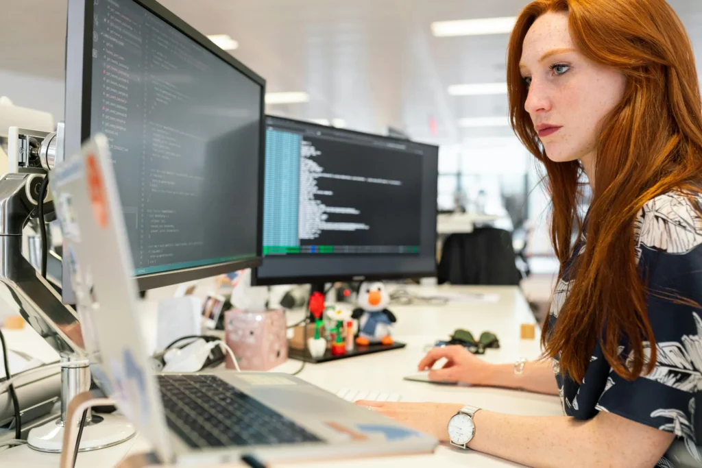 woman working on laptop - seo audit services for business websites