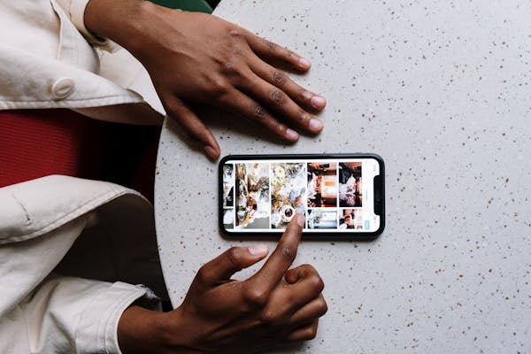 person using smartphone - citations for seo