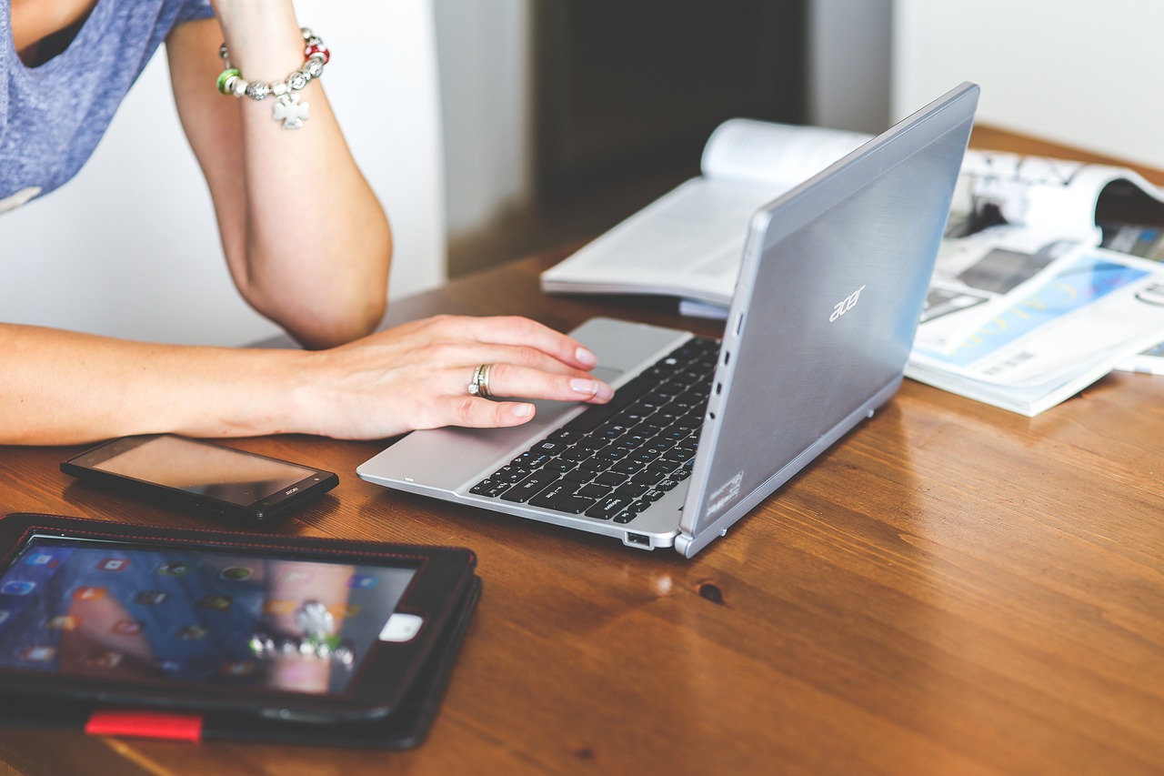 person working on laptop - seo audit services for business websites