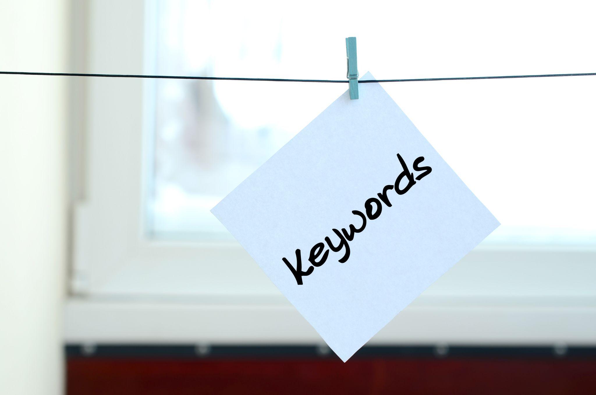 note with the word “keywords” hanging from clothespin